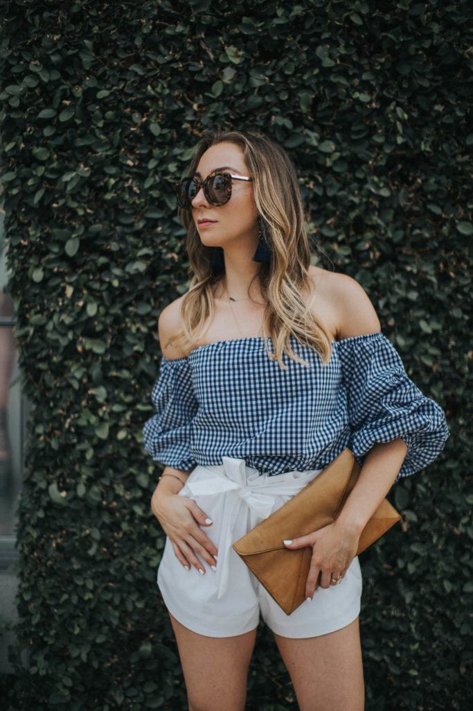 Blue gingham off the hsoulder top, white bow shorts, tassel earrings