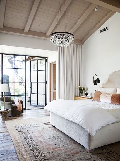 Layered Rugs in a Luxe Casual Bedroom