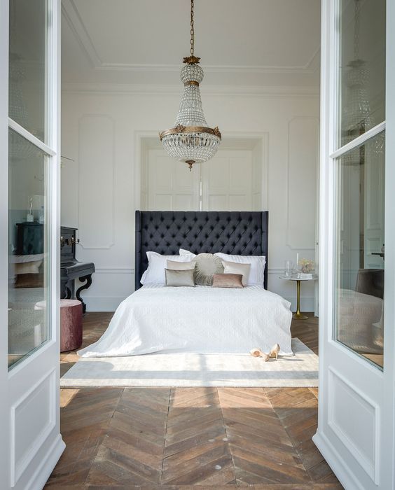 Dreamy Parisian inspired bedroom with a bee of bed rug