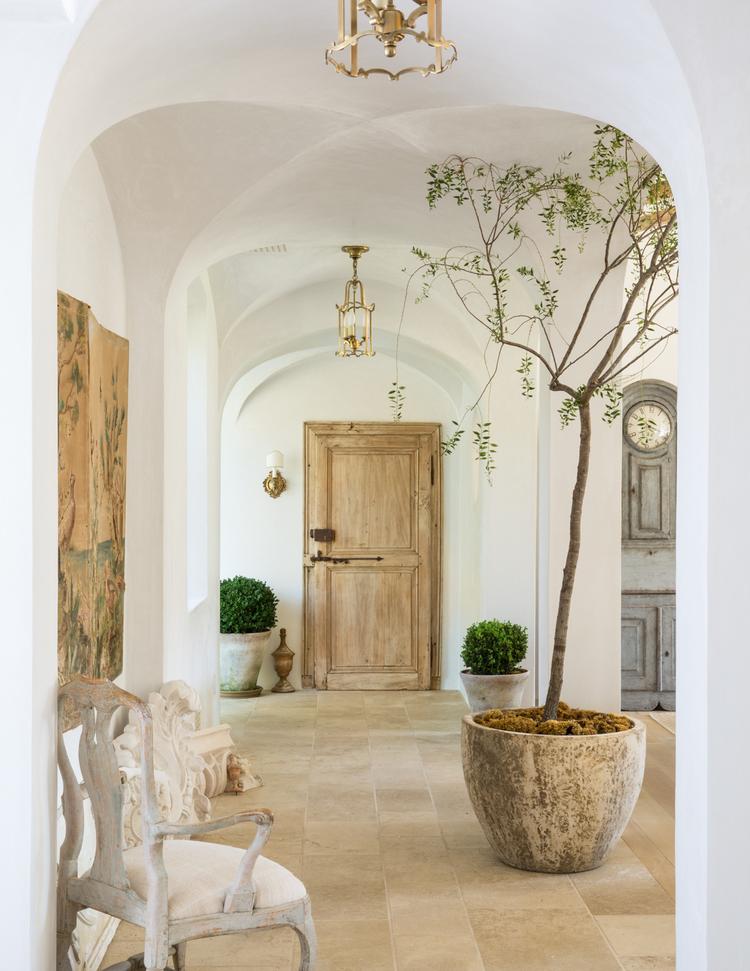 Light bright mediterranean hallway with arched ceilings